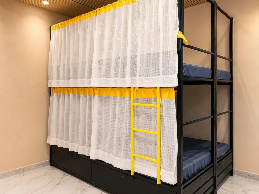 Air-conditioned bunk bed dormitory at the men's PG in Goregaon West